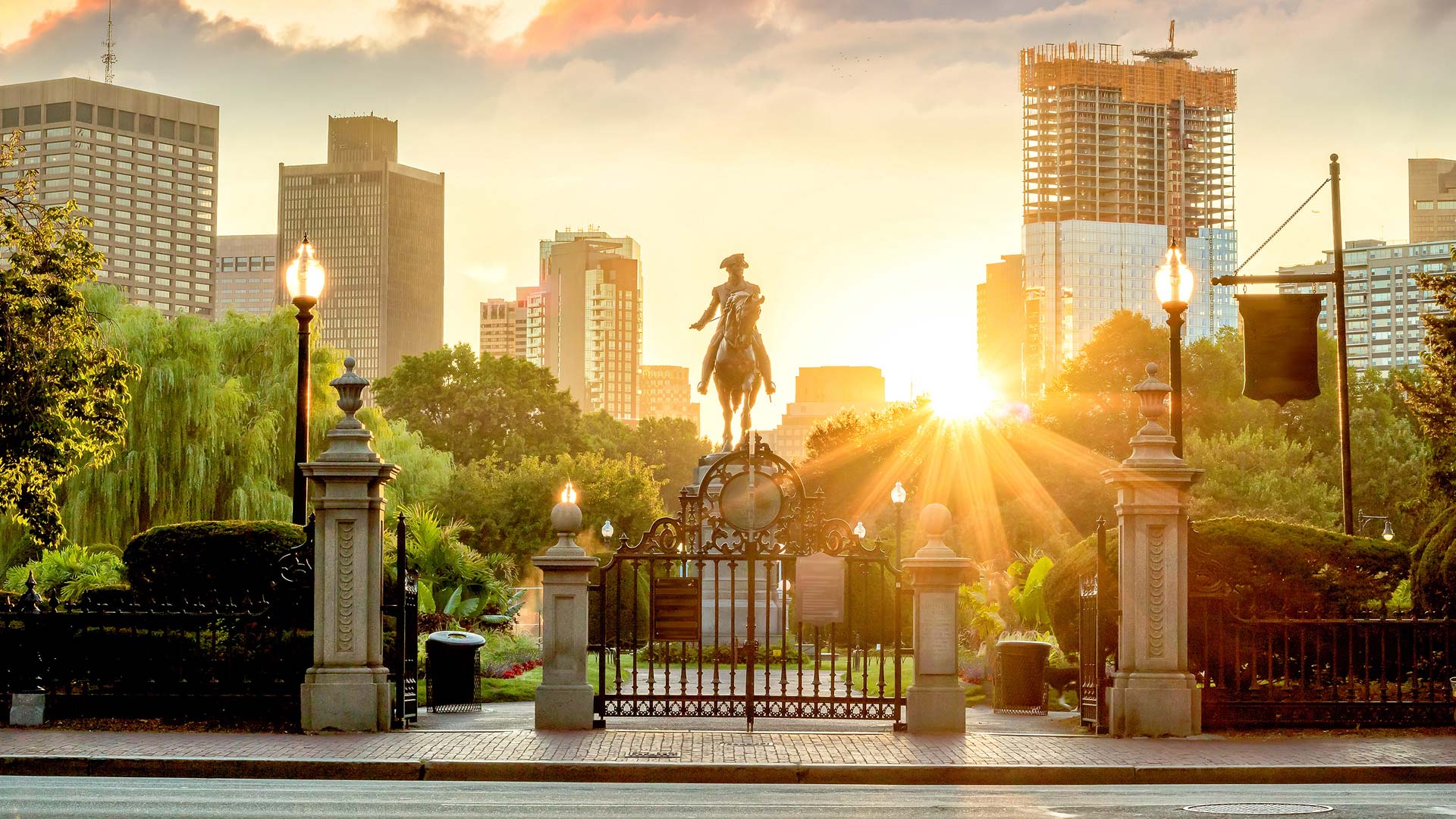 George Washington statue in garden in Boston during sunset.