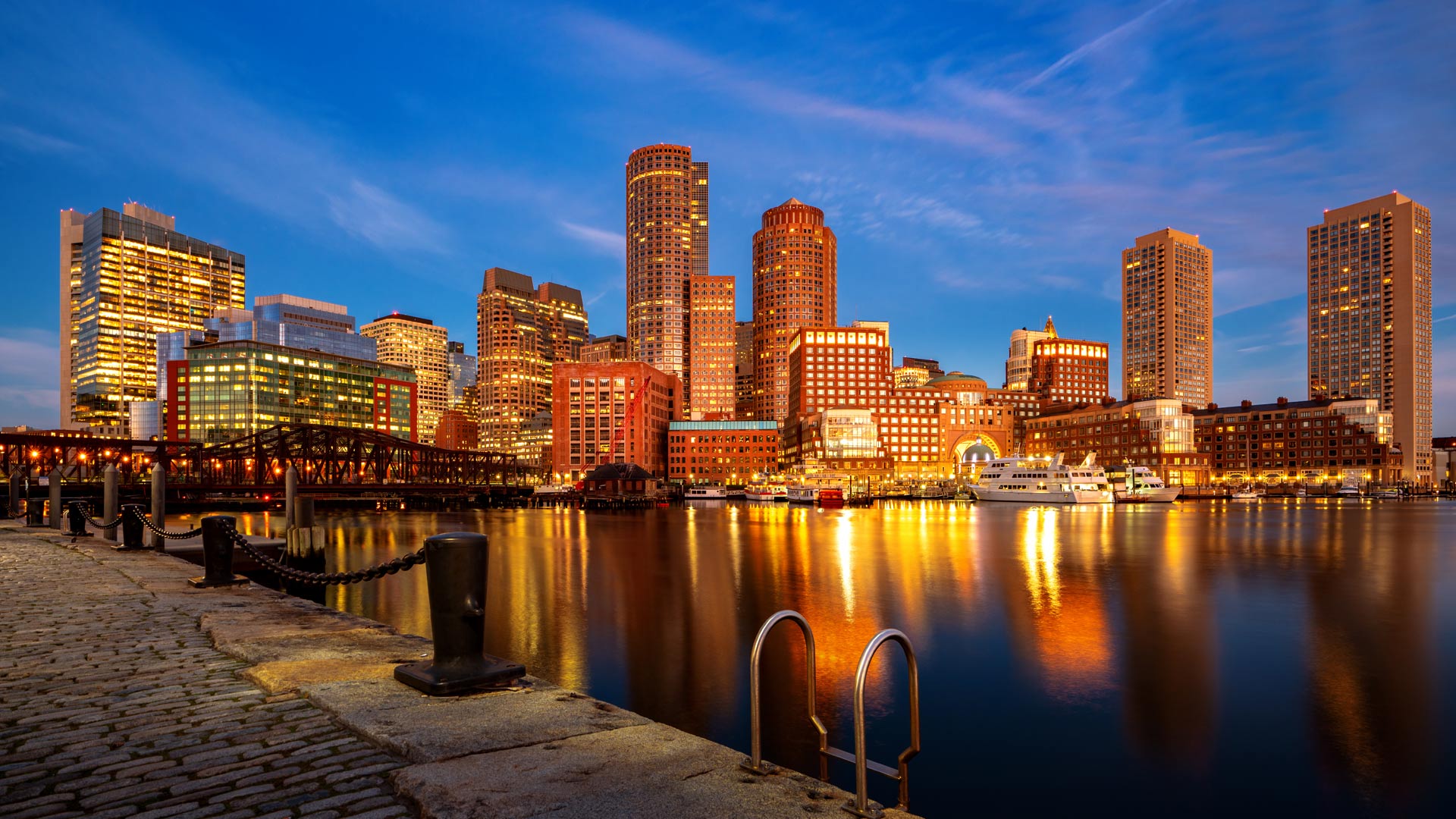 Boston harbor cityscape and skyline at night.
